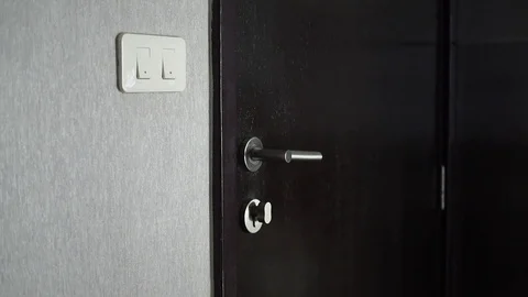 Man arriving at home, locking door and turning light on Stock Footage 88772003