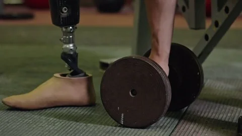 Man with Artificial Leg Training with Dumbbell Stock Footage 72139860