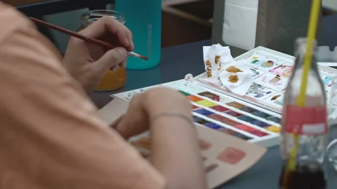 Man artist making drawing interior, working at the desk outdoor. Stock Footage 201891450