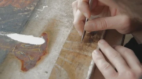 Man Artist Working in the Studio Restores the Icon of the Orthodox Saint Stock Footage 71553833
