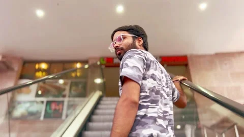 Man ascending an escalator Stock Footage 285421645