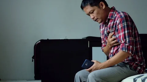Man asia having heart attack, needs first aid. Heart failure Stock Footage 114694791