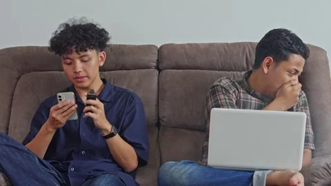 Man asking friend to stop vaping indoors due to secondhand smoke while using Stock Footage 332724127