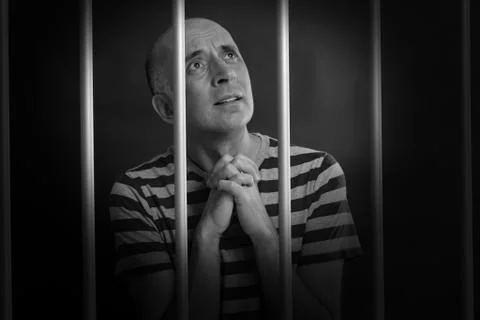 Man asking for mercy in prison Stock Photos