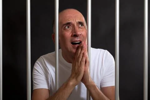 Man asking for mercy in prison Stock Photos