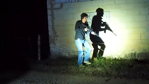 Man with assault rifle Stock Footage 69834061