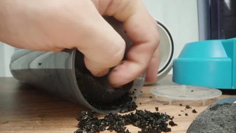 A man assembles a carbon water filter. Close-up. Stock Footage 250806250