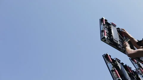 A man assembles LED panel elements Stockbeeldmateriaal 142841914