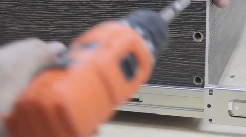 Man assembles a сabinet Stock Footage 59143142