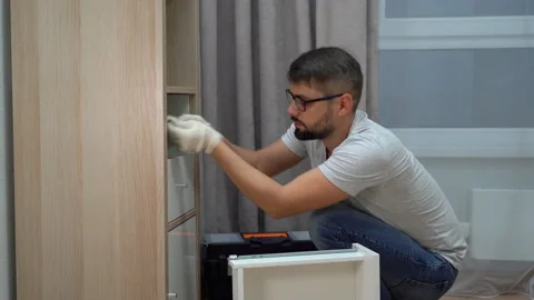 Elmstead storage solutions specialist assembling modular shelving unit