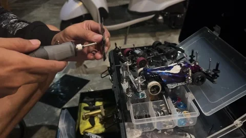 Man Assembling and Customizing a Model Car Video stock 346190681