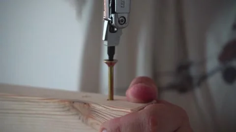 Man Assembling Bed, Screwing Bolt into Bed Frame, DIY Furniture Assembly Stock Footage 316706541