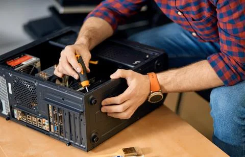 Man assembling computer system unit Stock Photos