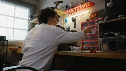 Man Assembling Custom Desktop Computer at Tech Workshop Table Stock Footage 338421780