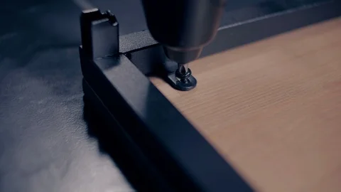 Man assembling desk with screwdriver Stock Footage 91494330