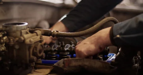 Man assembling engine of car Stock Footage 221107729