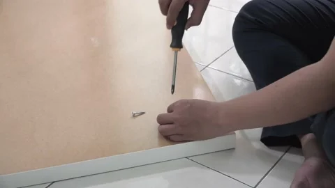 A man assembling IKEA table top Stock Footage 145704162