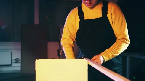 Man assembling an industrial shelf rack Stock Footage 145877965
