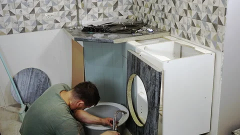 A man assembling kitchen furniture, timelapse. Stock Footage 206128063