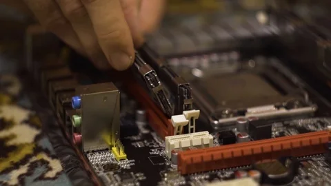 Man assembling motherboard. Close-Up. Stock Footage 99732982