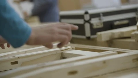 Man is assembling planks together Stock Footage 92672028