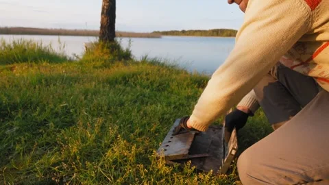 Man assembling portable barbecue grill outdoors Stock Footage 322647244