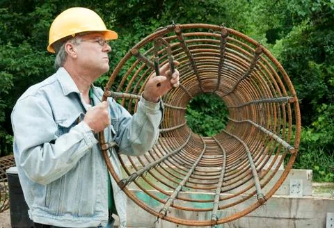 Man assembling rebar forms Photos