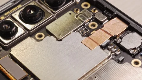 Man assembling a smartphone lens cover. Macro view 動画素材 127222489