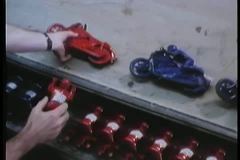 Man assembling toys on production line Видео 11352802