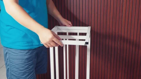 Man Assembling White Metal Rack Frame, DIY Home Improvement Stock Footage 333316653