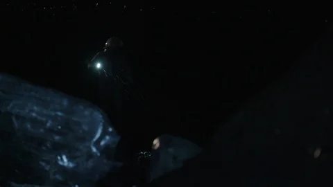 Man in astronaut suit exploring an ice cave, Iceland Video stock 104238118