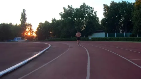 Man athlete jogging, training of stadium Vídeo Stock 169405984