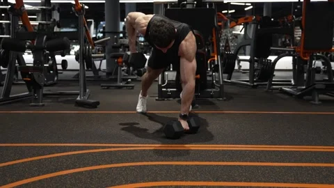 Man athlete lifting dumbbell. Strong man do sport exercise. Gym workout. Sport Stock Footage 346685134