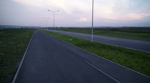 The man athlete running on the sidewalk Stock Footage 64618632