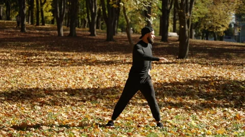 A man in an athletic form is stretching the muscles of the trunk Stock Footage 227695271