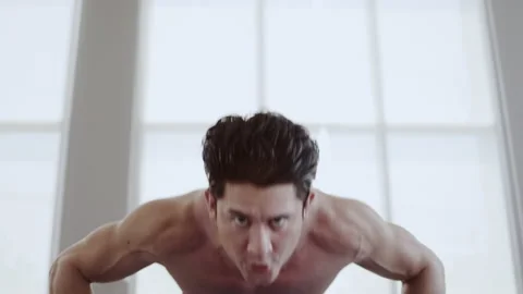 Man athletic trainer doing push up in gym And live teaching via laptop Or video Stock Footage 149000916