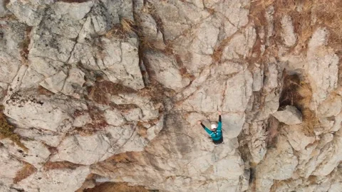 Man athlette climbing on the high rock Stock Footage 164538560