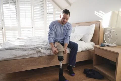 Man attaching leg prosthesis Stock Photos