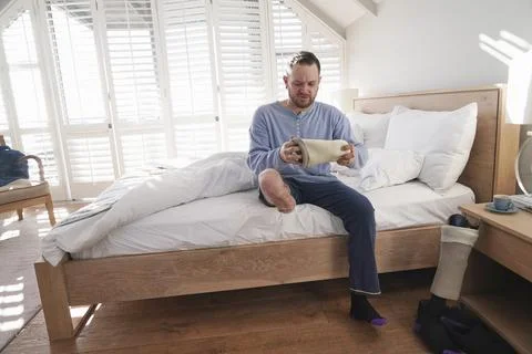 Man attaching leg prosthesis Stock Photos