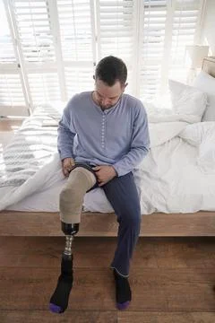 Man attaching leg prosthesis Stock Photos