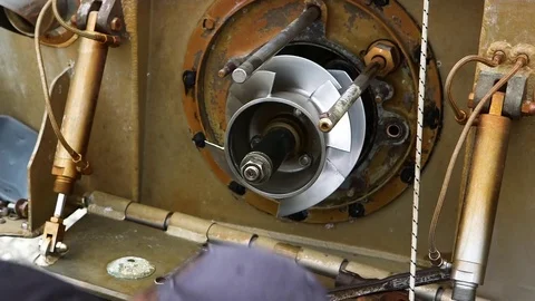 Man attaching a part from bottom section of boat Stock Footage 83182998