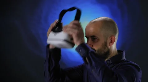 Man attaching a VR headset Stock Footage 62787290
