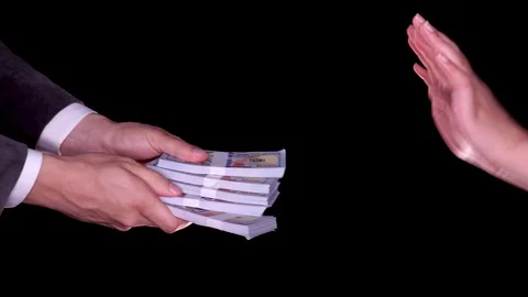 Man attempting to bribe someone. Stock Footage 116891777