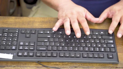 A man attempting to copy and paste on a windows keyboard Stock Footage 156529663