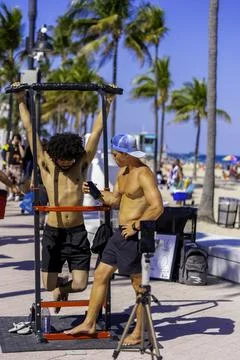 Man attempting a hang challenge for 140 seconds to win a money prise Stock Photos