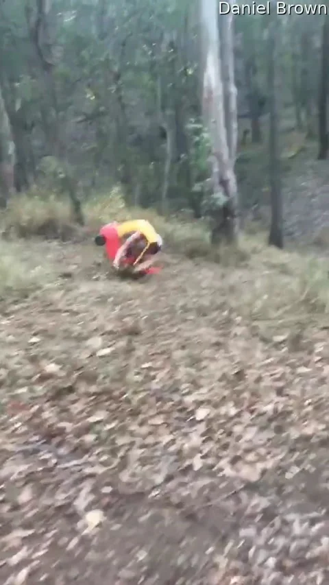 Man Attempts to Make It Down Hill in Toy Car, Brisbane, Queensland, Australia -  Stock Footage 205170966