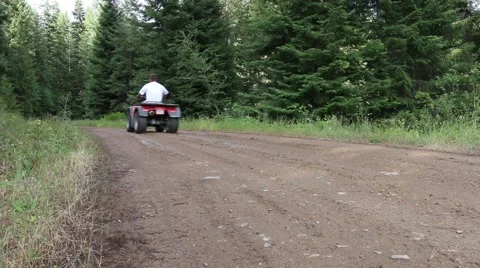 Man on ATV on mountain trail Stock Footage 52493737