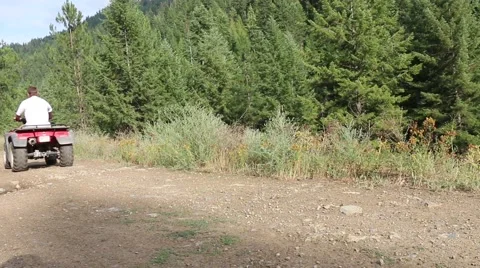 Man on ATV in mountains Stock Footage 52493350