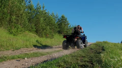 Man on ATV in mountains. Guy on quad bike. Stock Footage 291720201