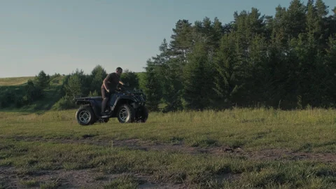 Man on ATV in mountains. Guy on quad bike Stock Footage 291734144